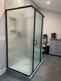 Semi-frameless pivot door + Matte Balck Hardware + Rain Glass
